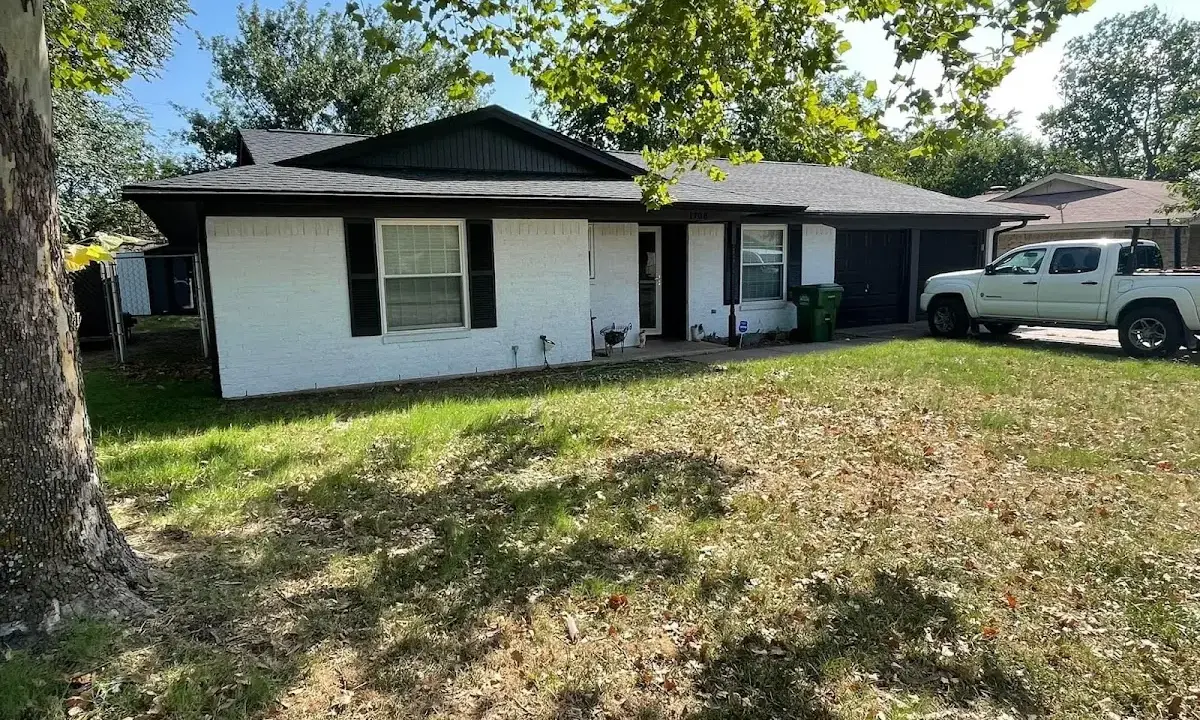 Professional roofing crew working on a residential roof in Sweetwater